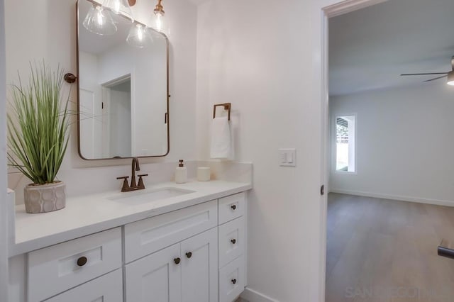 bathroom featuring vanity, ceiling fan, and hardwood / wood-style flooring