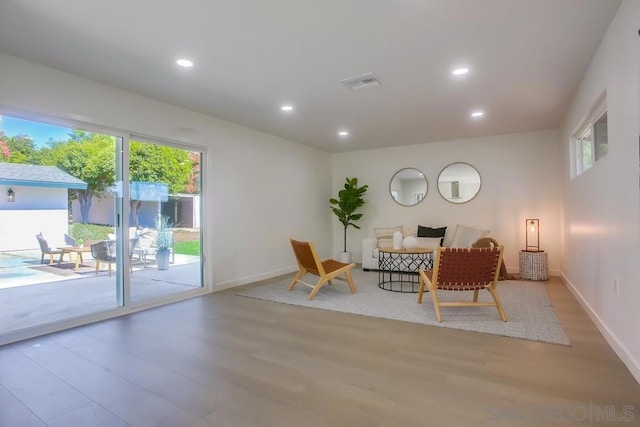 living area featuring light hardwood / wood-style flooring and a wealth of natural light