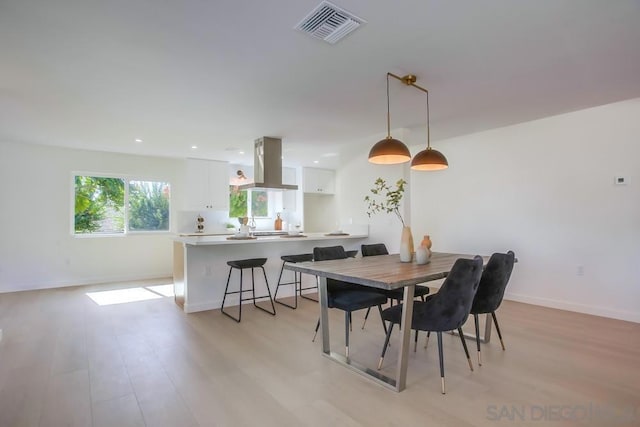 dining room with light hardwood / wood-style floors