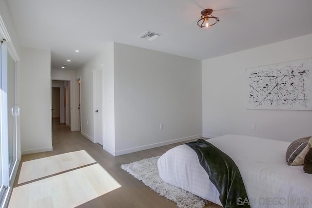 bedroom featuring wood-type flooring