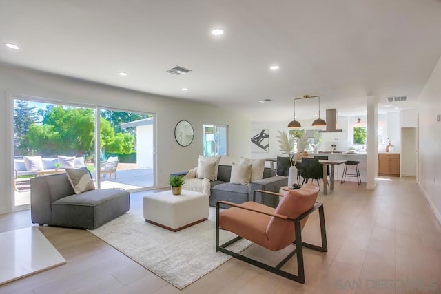 living room with light hardwood / wood-style flooring