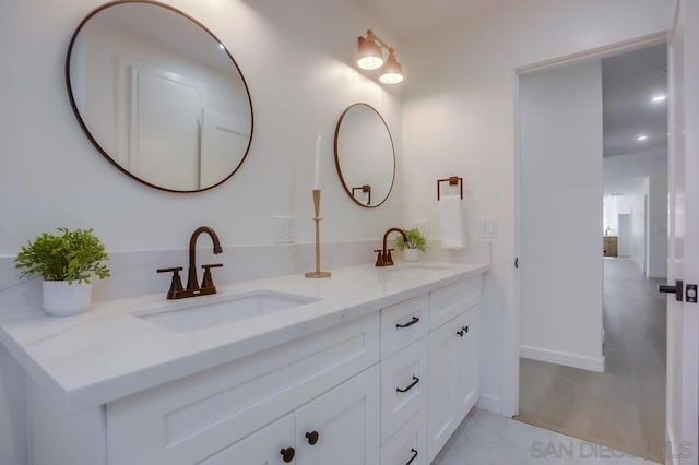 bathroom featuring vanity and hardwood / wood-style flooring