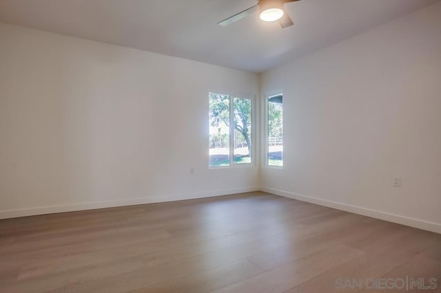 spare room with ceiling fan and light hardwood / wood-style flooring