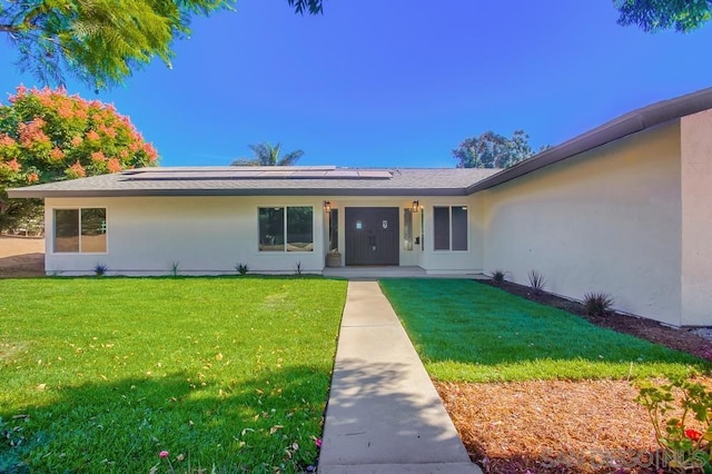 view of front of house with a front lawn