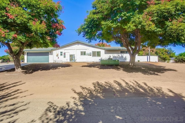 ranch-style home featuring a garage