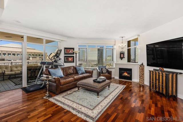 living room with crown molding, a wealth of natural light, and dark hardwood / wood-style floors