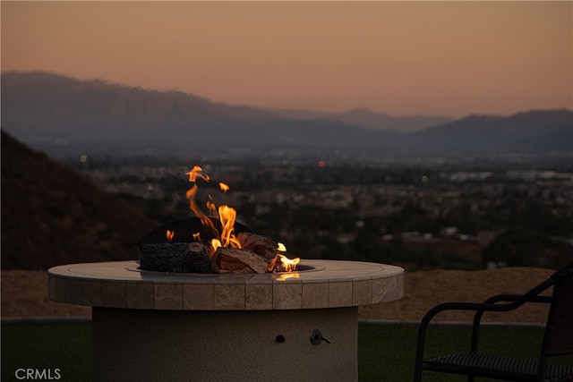 patio terrace at dusk with an outdoor fire pit