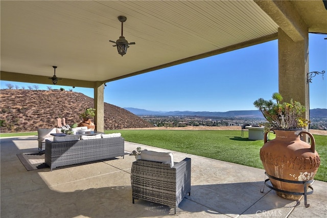 view of patio / terrace featuring a mountain view and outdoor lounge area