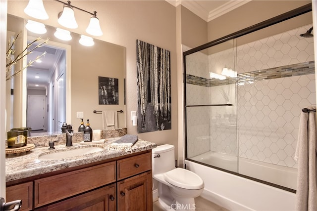 full bathroom with vanity, crown molding, combined bath / shower with glass door, and toilet