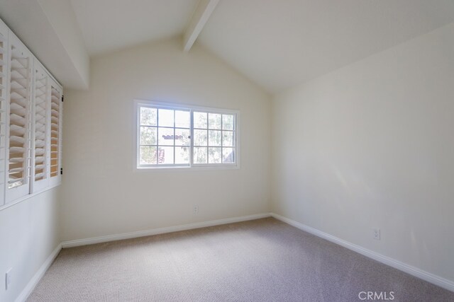 interior space featuring vaulted ceiling with beams