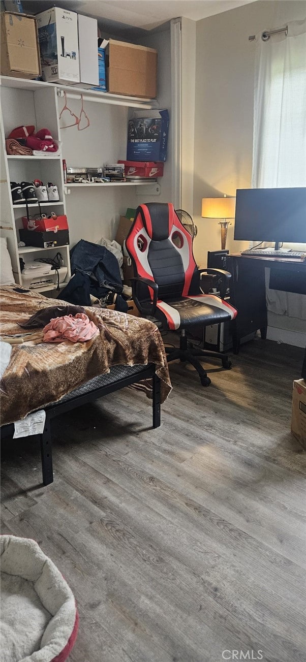 bedroom with wood-type flooring