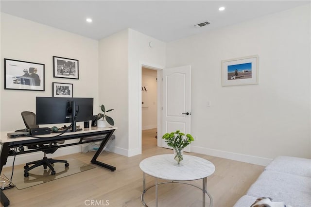 office area with light hardwood / wood-style flooring