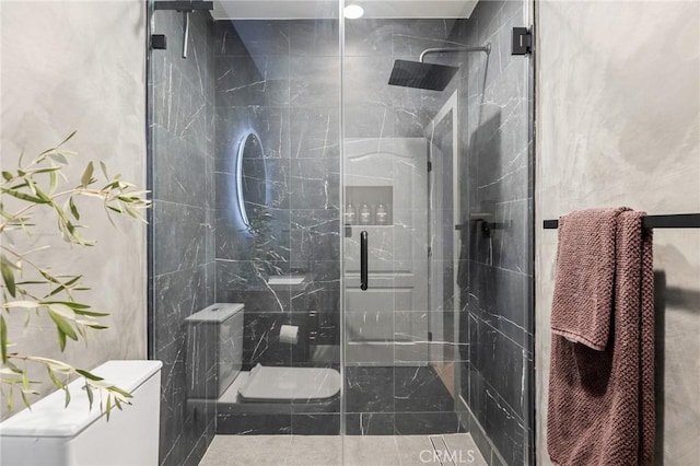 bathroom with a shower with shower door