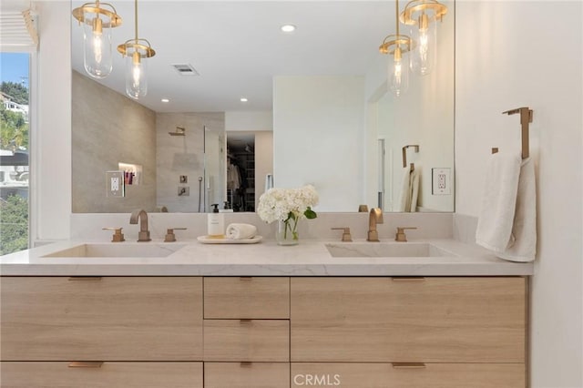 bathroom featuring vanity and a wealth of natural light