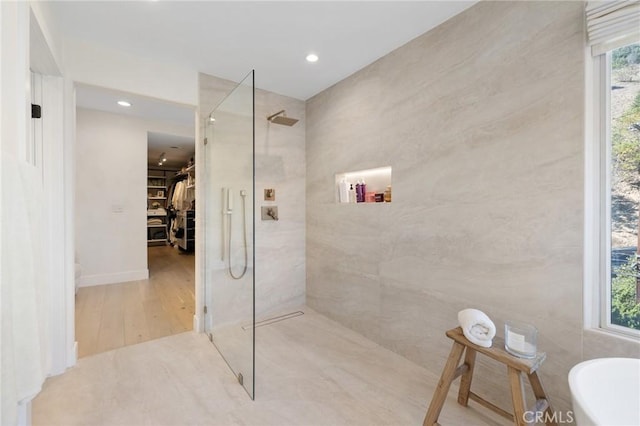 bathroom with tiled shower