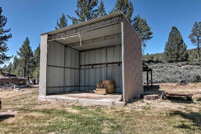 view of outbuilding featuring a yard