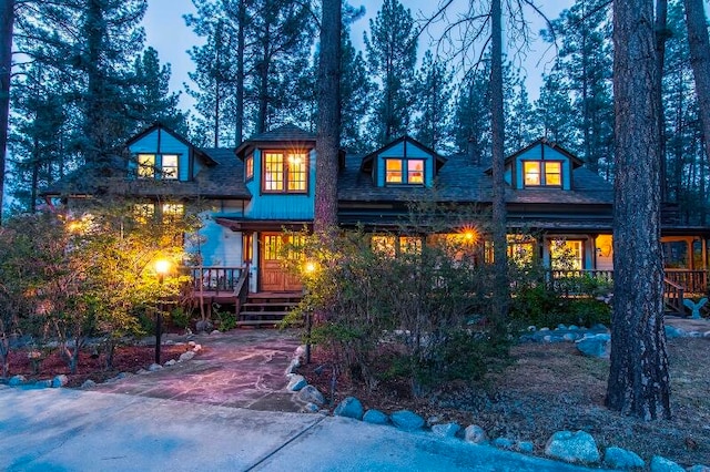 back of house with a wooden deck