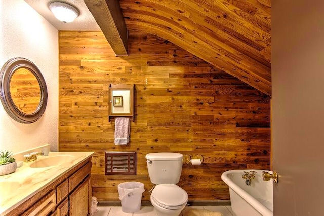 bathroom featuring toilet, tile patterned flooring, vanity, a bath, and wood walls