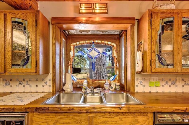 kitchen featuring backsplash and sink