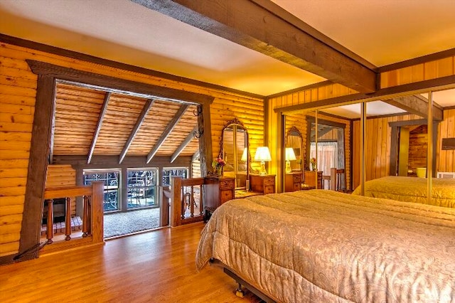 bedroom with hardwood / wood-style floors, access to outside, wooden ceiling, lofted ceiling with beams, and log walls