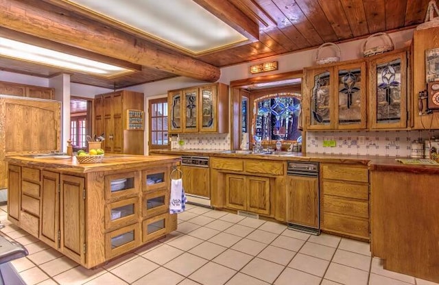 kitchen with wood ceiling, tasteful backsplash, white dishwasher, and light tile patterned floors