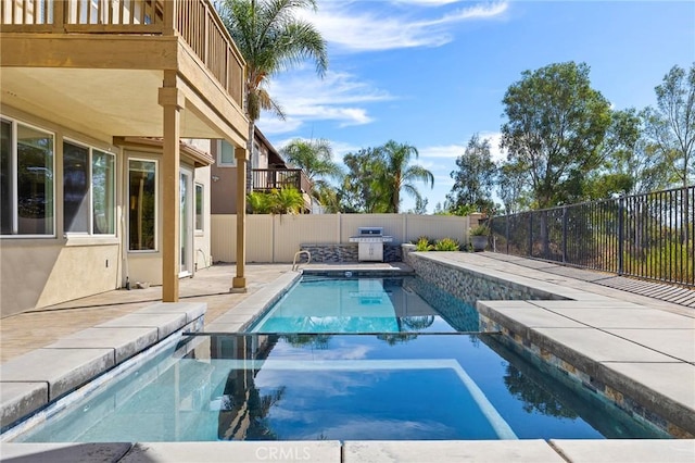 view of swimming pool with area for grilling, an in ground hot tub, and a patio