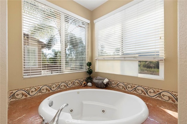 bathroom with a tub to relax in