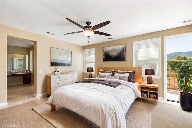 bedroom featuring access to exterior and ceiling fan