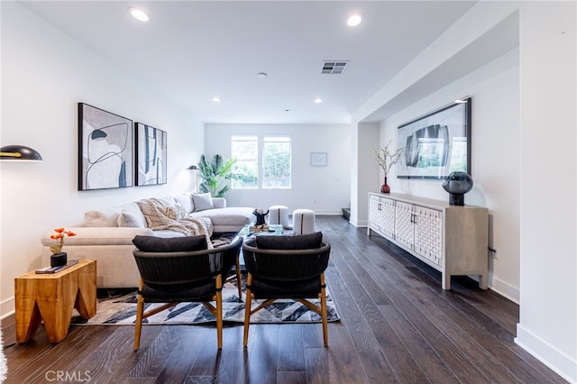 living room with dark hardwood / wood-style flooring