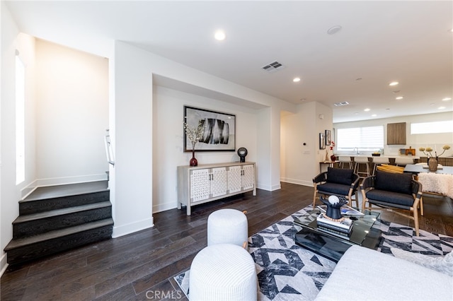 living room with dark hardwood / wood-style floors