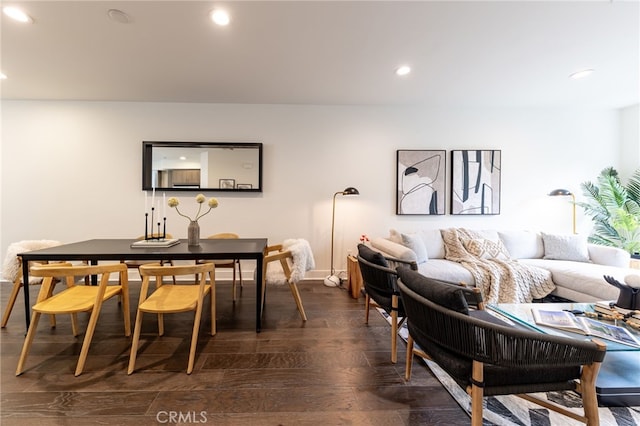 dining space with dark hardwood / wood-style floors