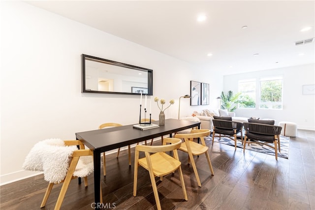 dining area featuring dark hardwood / wood-style floors