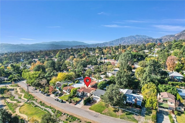 birds eye view of property with a mountain view