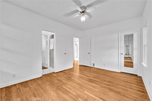 unfurnished bedroom featuring ceiling fan and light wood-type flooring