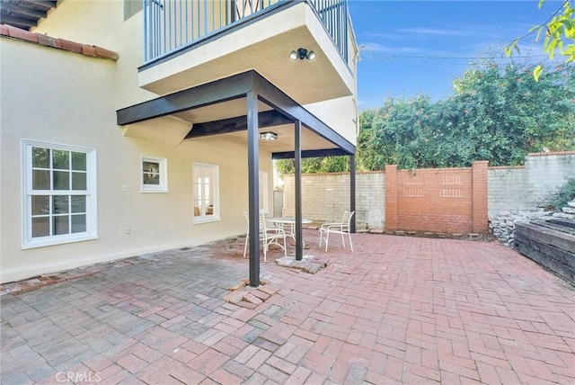 view of patio with a balcony