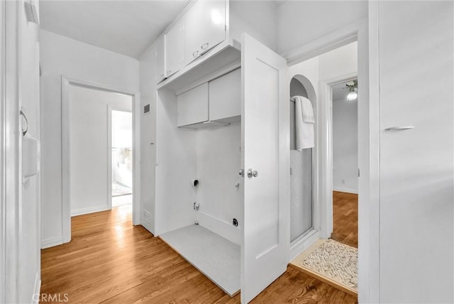 interior space with ceiling fan and hardwood / wood-style floors