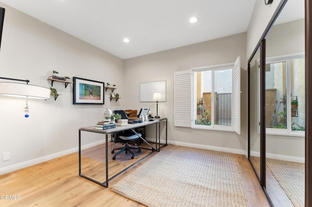 office space featuring light hardwood / wood-style flooring and plenty of natural light