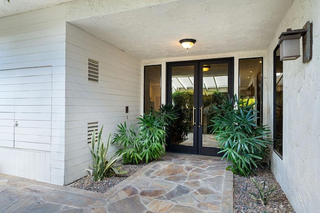 doorway to property featuring french doors