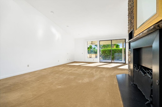 carpeted living room featuring high vaulted ceiling and ceiling fan