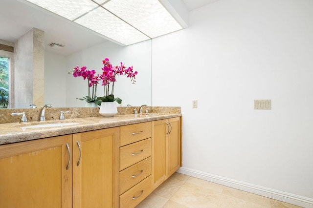 bathroom featuring tile patterned floors and vanity