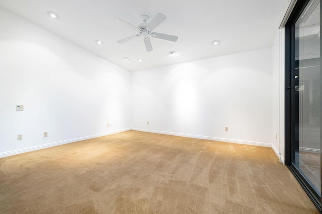 empty room with light carpet and ceiling fan