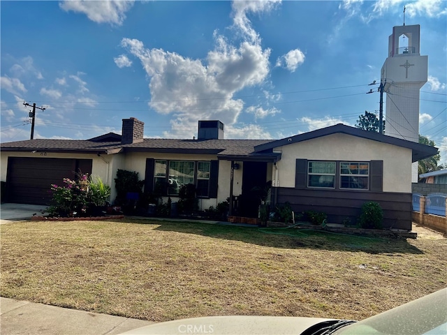 single story home with a front lawn and a garage