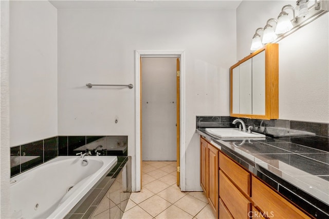 bathroom featuring vanity, tile patterned floors, and tiled tub