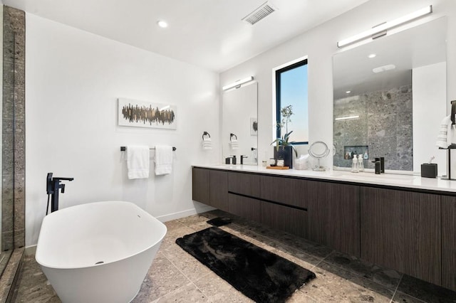 bathroom featuring vanity and plus walk in shower