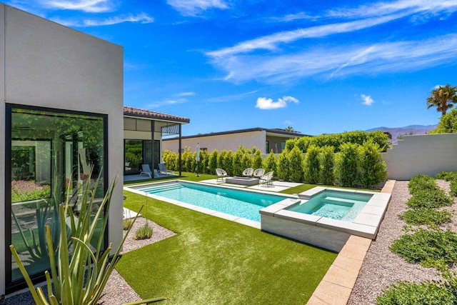 view of swimming pool featuring an in ground hot tub, a yard, and a patio area