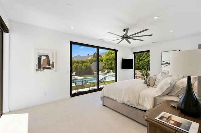 bedroom featuring light carpet, access to outside, and ceiling fan