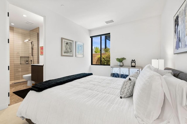 carpeted bedroom featuring connected bathroom