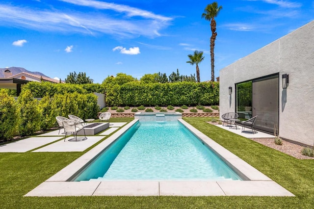 view of pool featuring a yard and a patio area