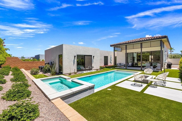 view of swimming pool featuring an in ground hot tub, a patio, and a yard