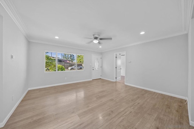 empty room featuring ceiling fan, light hardwood / wood-style floors, and ornamental molding